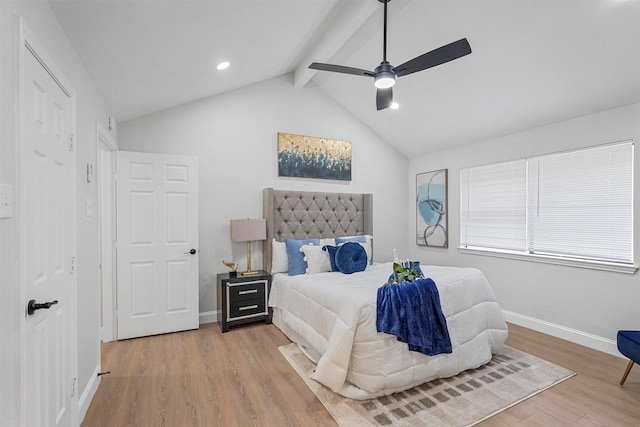 bedroom featuring ceiling fan, light hardwood / wood-style flooring, and lofted ceiling with beams