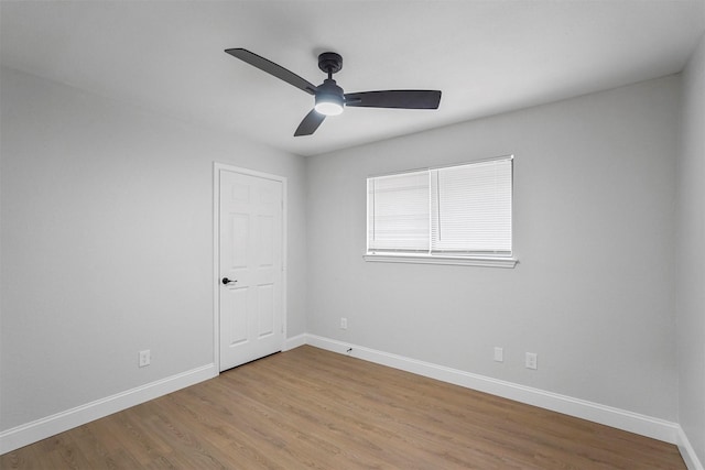 empty room with ceiling fan and light wood-type flooring