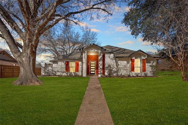 view of front of home with a yard