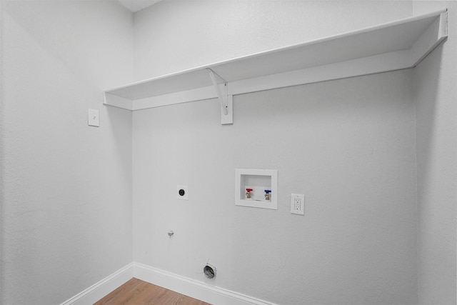 laundry room featuring wood-type flooring, washer hookup, hookup for an electric dryer, and gas dryer hookup