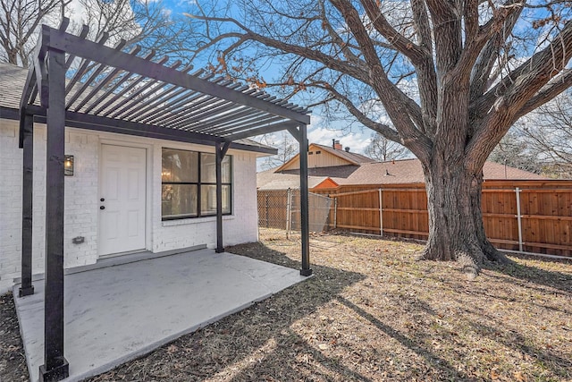 view of yard with a pergola and a patio