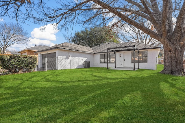 rear view of house with cooling unit, a yard, a pergola, and a patio area