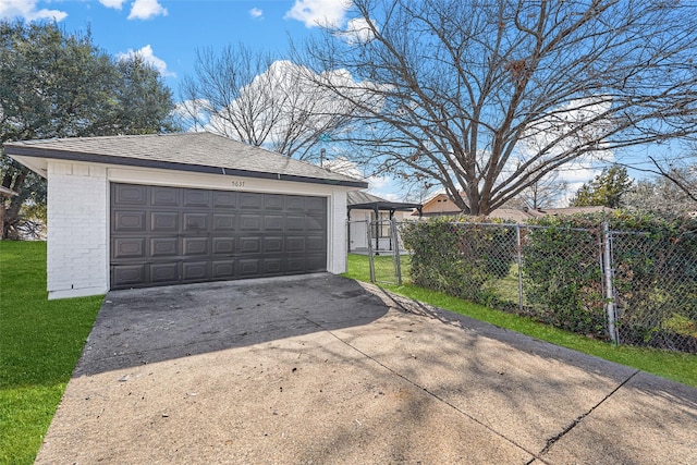 garage featuring a lawn