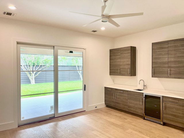 5808 Brookstown Dr, Dallas, TX 75230 - bar featuring wine cooler, plenty of natural light, a ceiling fan, light wood finished floors, and recessed lighting
