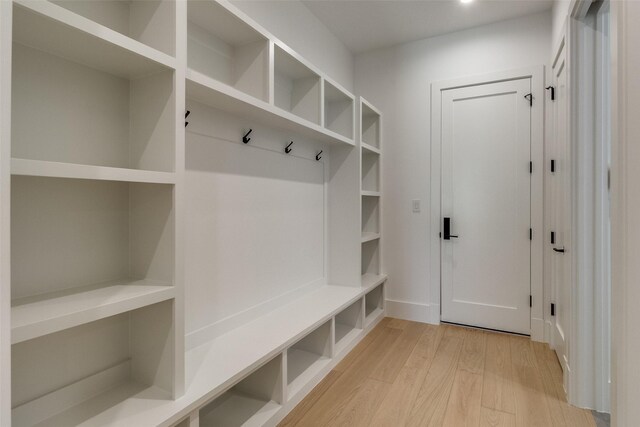 5808 Brookstown Dr, Dallas, TX 75230 - mudroom featuring wood finished floors