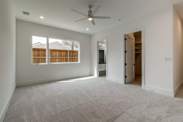 5808 Brookstown Dr, Dallas, TX 75230 - unfurnished bedroom featuring a walk in closet, carpet, baseboards, recessed lighting, and connected bathroom