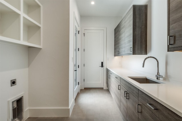 5808 Brookstown Dr, Dallas, TX 75230 - laundry room with hookup for an electric dryer, cabinet space, recessed lighting, and baseboards