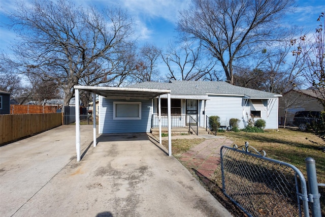 single story home with a carport and a porch