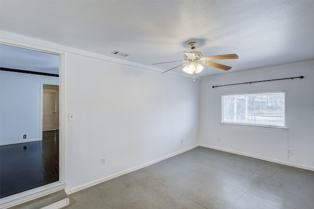 spare room with ceiling fan