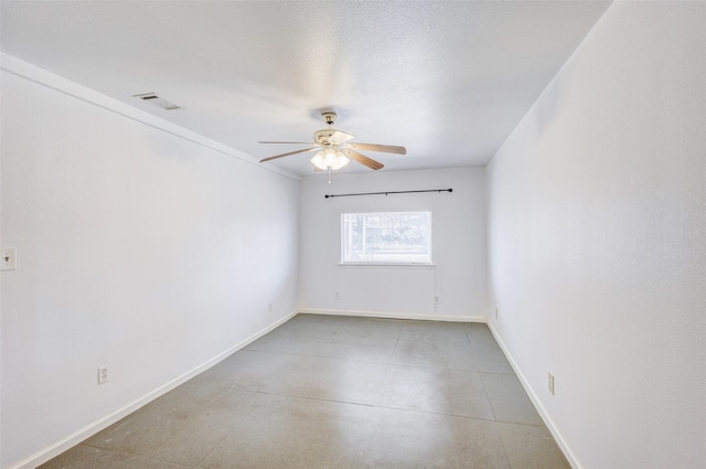 spare room with ceiling fan