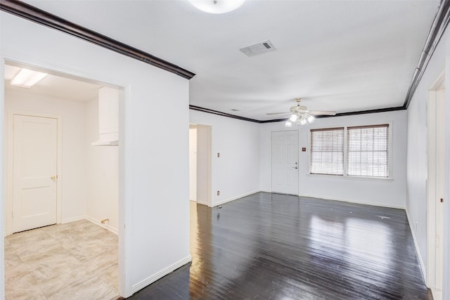 unfurnished room with ceiling fan, crown molding, and hardwood / wood-style floors