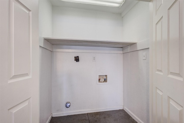 laundry room featuring washer hookup and dark tile patterned floors