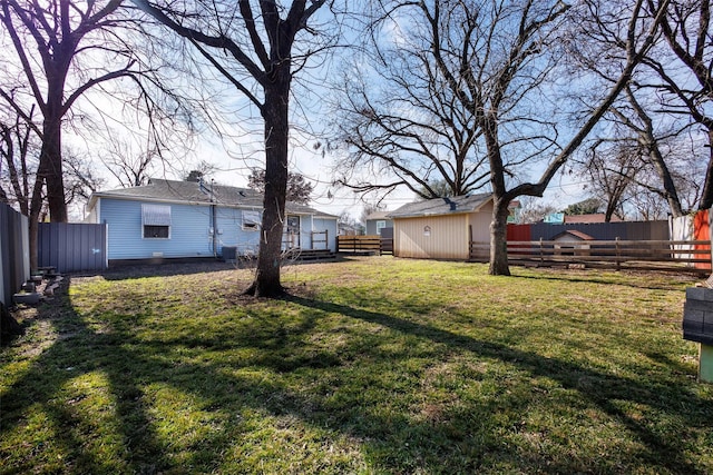 view of yard with an outbuilding and central AC unit