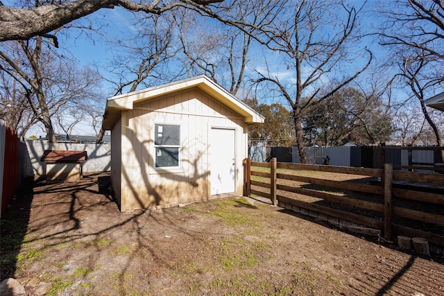 view of side of home featuring a storage unit