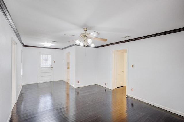 empty room with ceiling fan, dark wood-type flooring, and crown molding