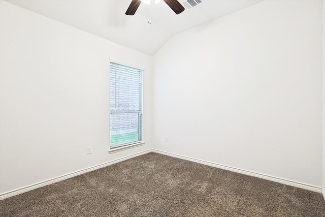 spare room featuring carpet floors, lofted ceiling, ceiling fan, and a healthy amount of sunlight