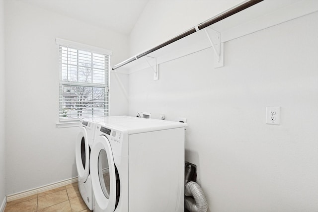 laundry area featuring light tile patterned floors and separate washer and dryer