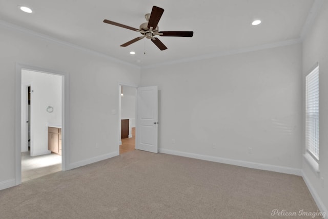 interior space featuring light carpet, ceiling fan, and ornamental molding