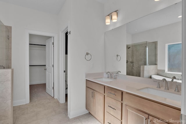 bathroom featuring vanity, tile patterned flooring, and walk in shower