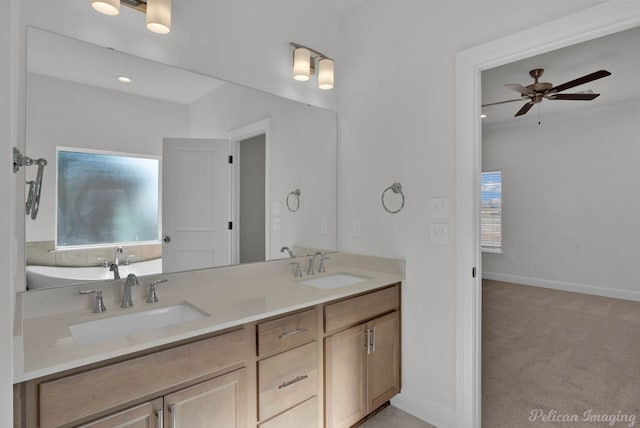 bathroom with ceiling fan and vanity