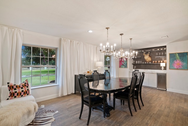 dining room featuring a chandelier and hardwood / wood-style floors