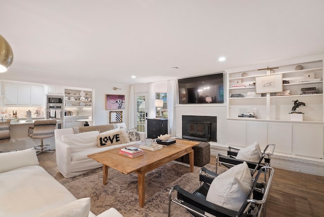 living room featuring a fireplace and hardwood / wood-style floors