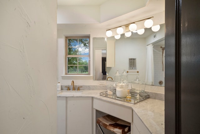 bathroom with vanity and a shower with shower curtain