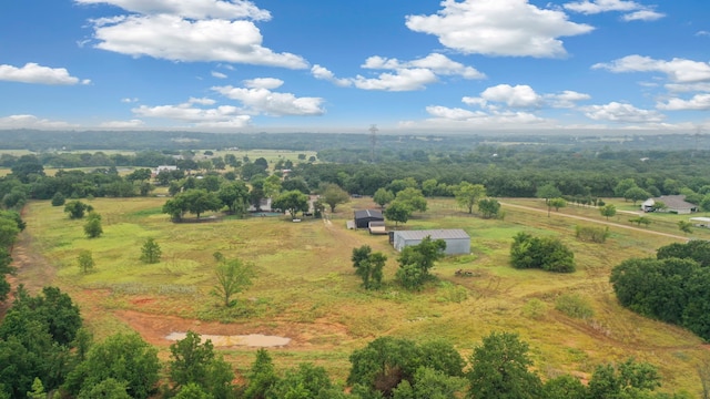 birds eye view of property featuring a rural view