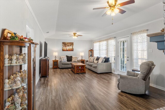 living room featuring ceiling fan, dark hardwood / wood-style floors, and ornamental molding