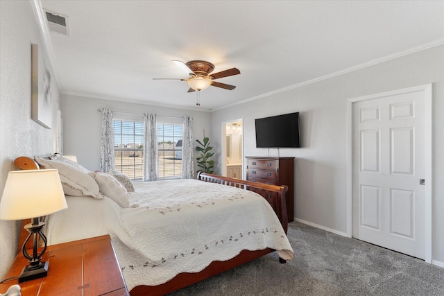 carpeted bedroom with ceiling fan, ensuite bathroom, and ornamental molding