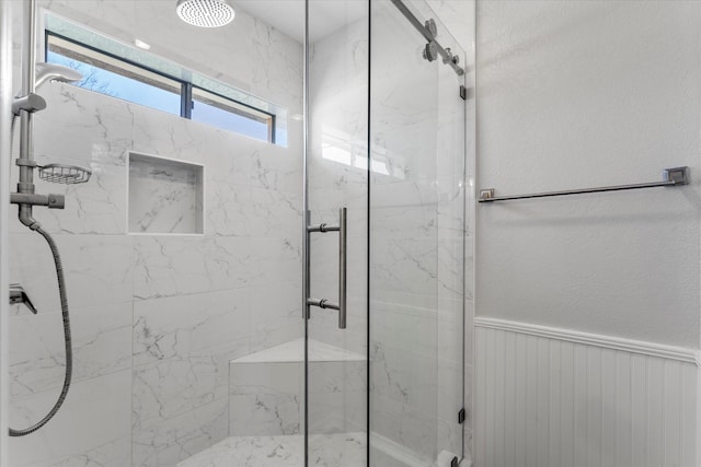 bathroom featuring an enclosed shower