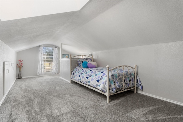 bedroom with a textured ceiling, lofted ceiling, and carpet flooring