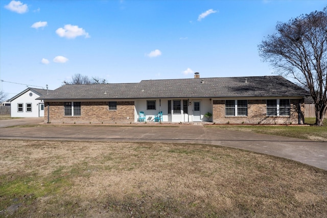 ranch-style house with a front lawn