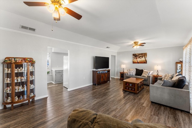 living room featuring ceiling fan and dark wood-type flooring