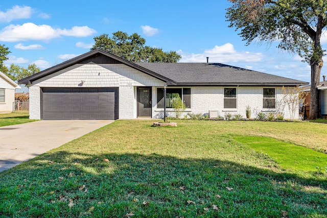 ranch-style house featuring a front yard and a garage