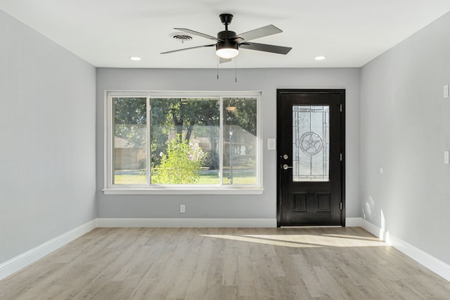 entryway with ceiling fan and light hardwood / wood-style flooring