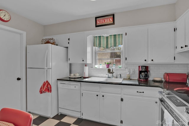 kitchen featuring sink, white appliances, white cabinets, and tasteful backsplash