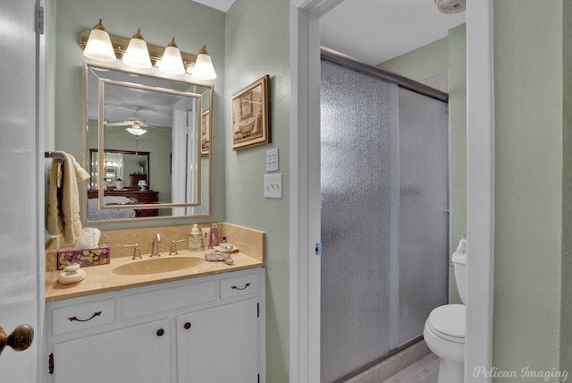 bathroom with walk in shower, vanity, and toilet