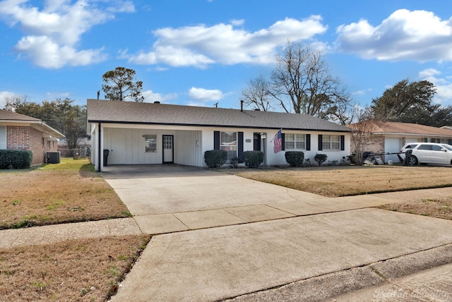 single story home with a front lawn, central AC, and a carport