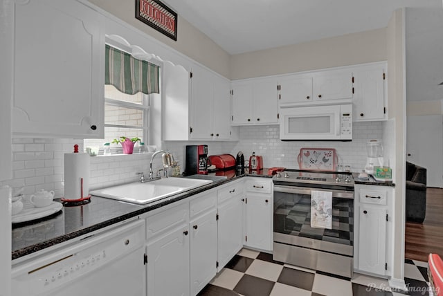 kitchen with sink, white cabinets, and white appliances