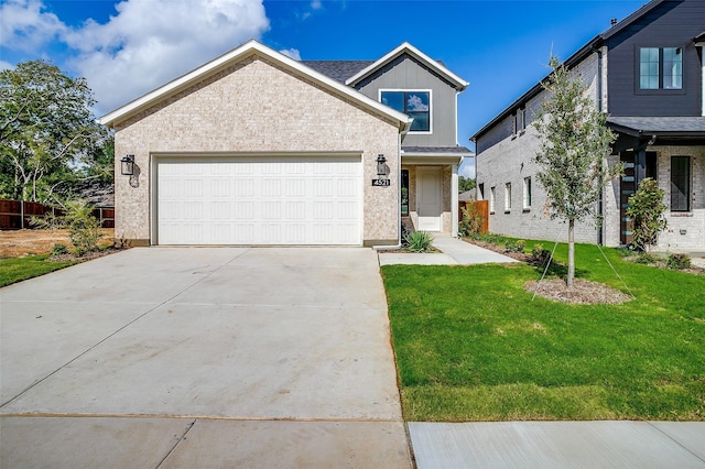 view of front of property with a garage and a front lawn