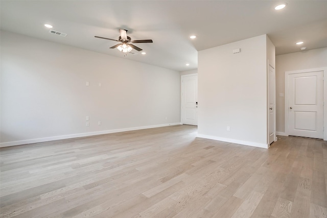 spare room featuring ceiling fan and light wood-type flooring