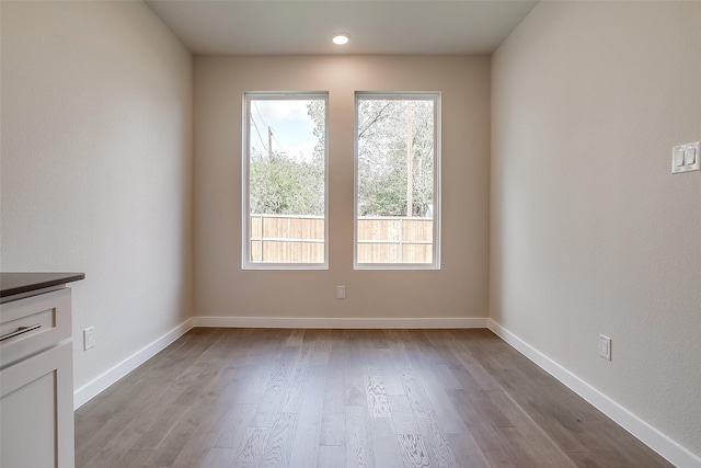 spare room with light wood-type flooring