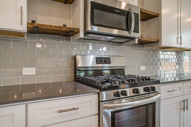 kitchen featuring backsplash, stainless steel appliances, and white cabinets