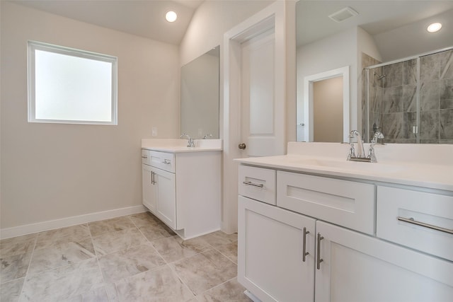 bathroom with lofted ceiling, a shower with door, and vanity