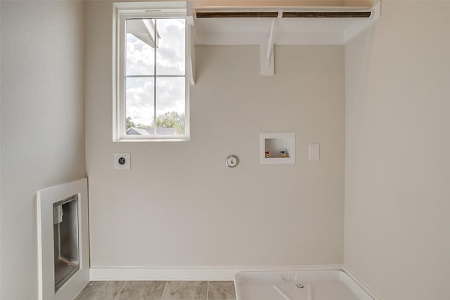 washroom featuring gas dryer hookup, washer hookup, and hookup for an electric dryer