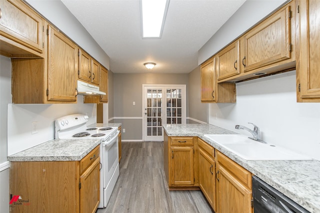 kitchen with electric stove, dishwasher, french doors, light hardwood / wood-style flooring, and sink