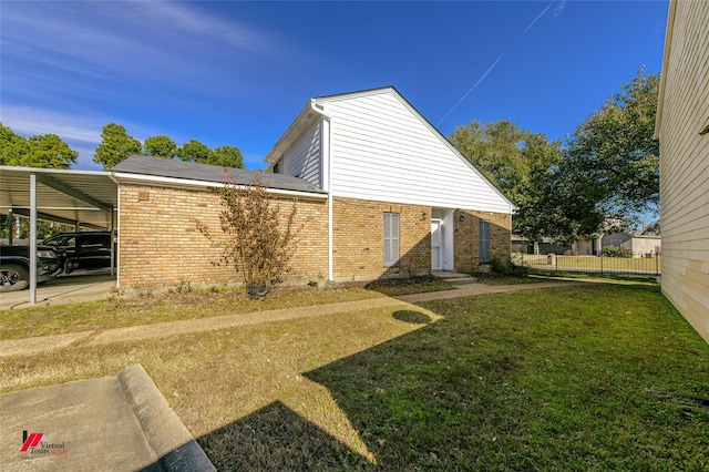 view of property exterior with a lawn and a carport