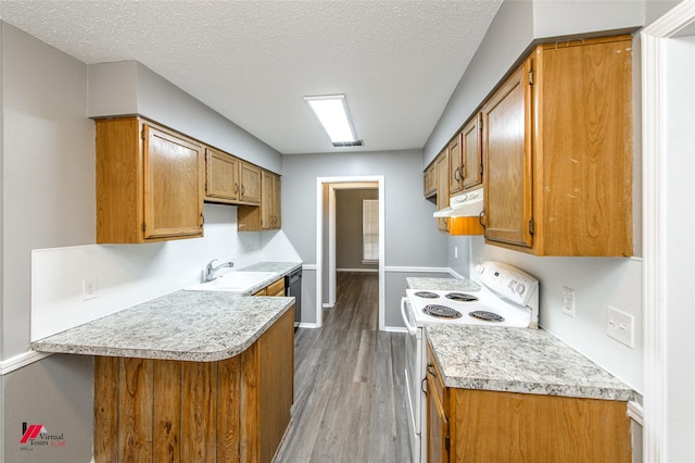 kitchen with kitchen peninsula, white electric range, sink, light hardwood / wood-style flooring, and a textured ceiling