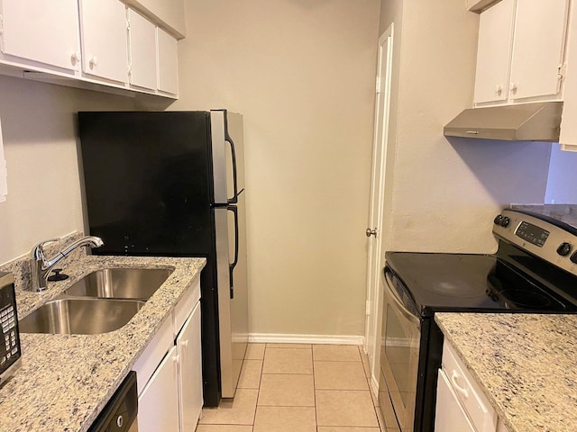 kitchen featuring white cabinetry, appliances with stainless steel finishes, light tile patterned flooring, light stone countertops, and sink